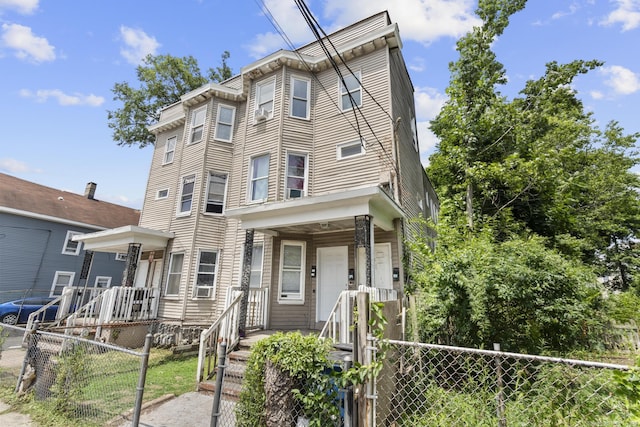 215 Rosette St, New Haven, CT 06519 - townhome / multi-family property featuring a fenced front yard and a gate