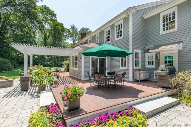 9 Tallwood Rd, Woodbridge, CT 06525 - wooden deck with outdoor dining space, a fire pit, grilling area, and a pergola