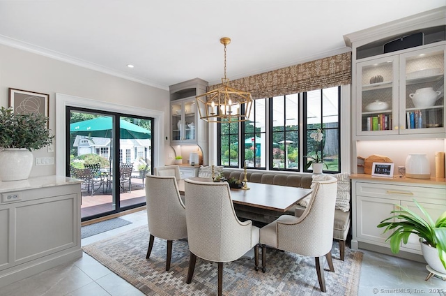 9 Tallwood Rd, Woodbridge, CT 06525 - dining area with crown molding, a chandelier, and light tile patterned floors