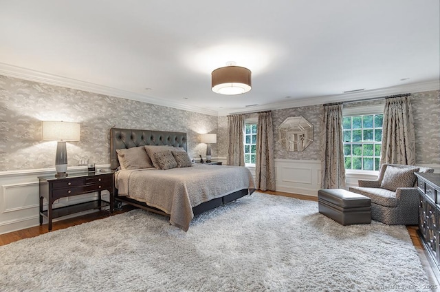 9 Tallwood Rd, Woodbridge, CT 06525 - bedroom with wallpapered walls, wood finished floors, ornamental molding, a wainscoted wall, and a decorative wall