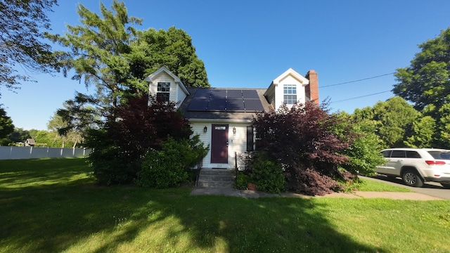 253 E Rd, East Windsor, CT 06016 - view of front of property featuring solar panels, a chimney, a front yard, and entry steps