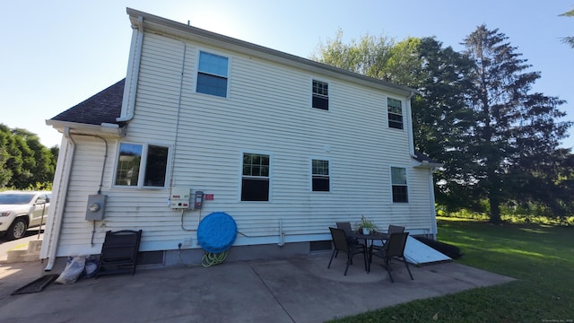 253 E Rd, East Windsor, CT 06016 - back of property featuring a lawn and a patio area
