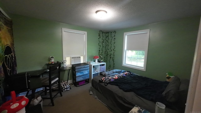 253 E Rd, East Windsor, CT 06016 - bedroom with carpet, a textured ceiling, and cooling unit