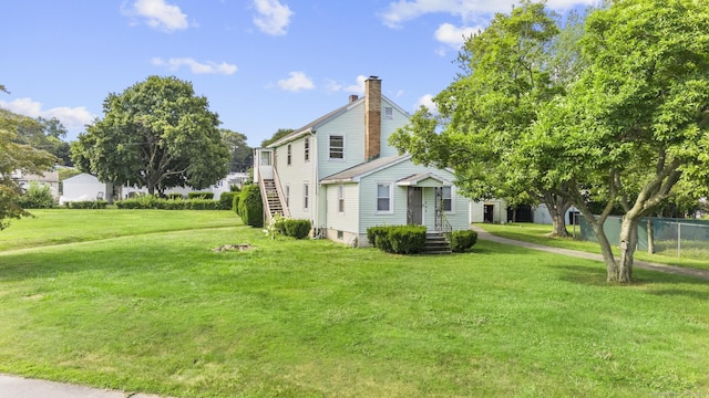 460 Stonybrook Rd, Stratford, CT 06614 - view of side of property featuring a chimney and a lawn
