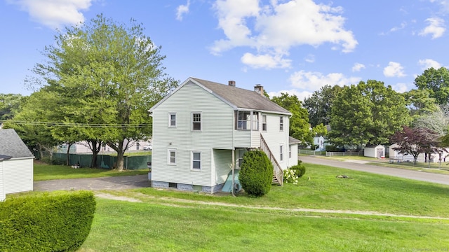460 Stonybrook Rd, Stratford, CT 06614 - view of side of property with a chimney and a lawn