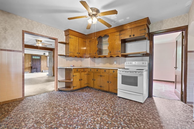 460 Stonybrook Rd, Stratford, CT 06614 - kitchen with open shelves, white range with electric cooktop, ceiling fan, wallpapered walls, and brown cabinetry