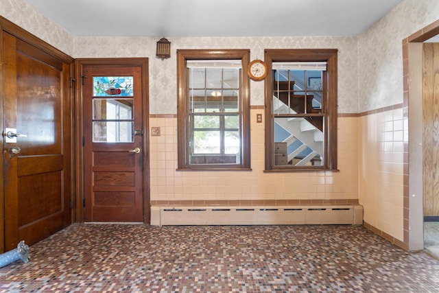 460 Stonybrook Rd, Stratford, CT 06614 - entrance foyer featuring tile walls, a baseboard radiator, wainscoting, wallpapered walls, and tile patterned floors