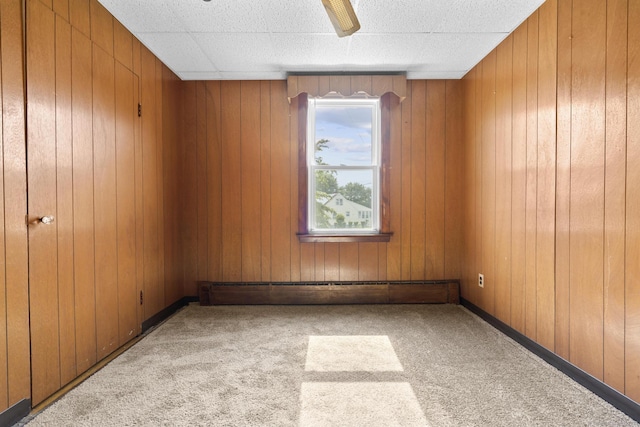 460 Stonybrook Rd, Stratford, CT 06614 - empty room featuring carpet, wooden walls, and a ceiling fan