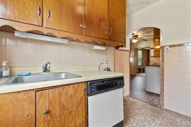 460 Stonybrook Rd, Stratford, CT 06614 - kitchen featuring white dishwasher, washer / dryer, light countertops, ceiling fan, and tile walls