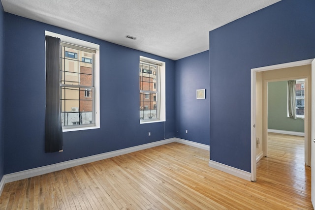 196 Crown St Unit 3J, New Haven, CT 06510 - empty room with a textured ceiling and hardwood / wood-style floors