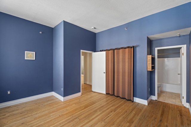 196 Crown St Unit 3J, New Haven, CT 06510 - unfurnished bedroom with wood finished floors and baseboards