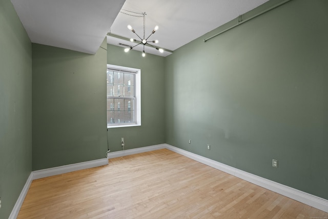 196 Crown St Unit 3J, New Haven, CT 06510 - empty room featuring a chandelier and wood finished floors