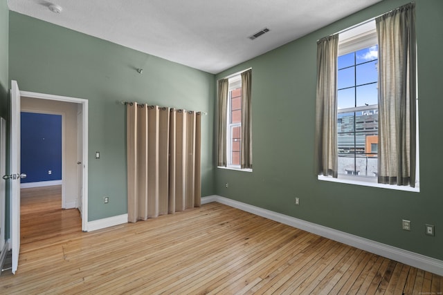 196 Crown St Unit 3J, New Haven, CT 06510 - unfurnished room with hardwood / wood-style floors, plenty of natural light, and a smoke detector