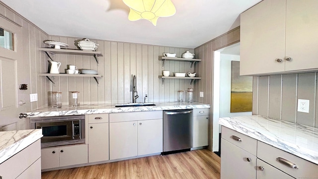 671 Fairview Ave, Bridgeport, CT 06606 - kitchen with open shelves, stainless steel appliances, light wood-type flooring, and light stone countertops