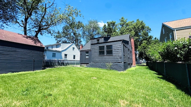 671 Fairview Ave, Bridgeport, CT 06606 - rear view of house with a fenced backyard