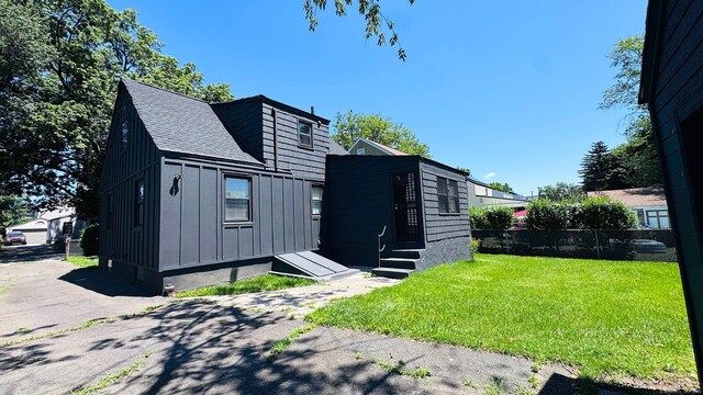 671 Fairview Ave, Bridgeport, CT 06606 - view of front facade with board and batten siding, roof with shingles, and entry steps