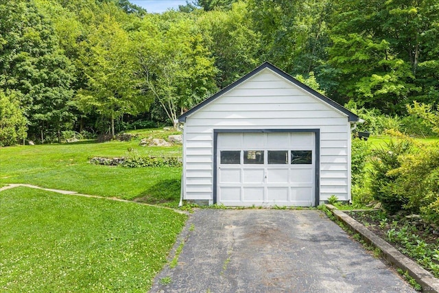10 Gifford Ln, Norwich, CT 06389 - detached garage featuring driveway and a wooded view