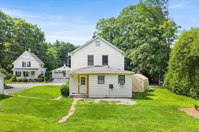 10 Gifford Ln, Norwich, CT 06389 - back of house with an outbuilding, a lawn, and a chimney