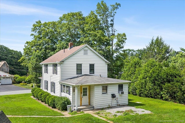 10 Gifford Ln, Norwich, CT 06389 - view of front of house with a chimney, a front yard, and roof with shingles