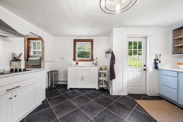 10 Gifford Ln, Norwich, CT 06389 - kitchen featuring wall chimney range hood, open shelves, dark tile patterned flooring, black electric stovetop, and white cabinetry