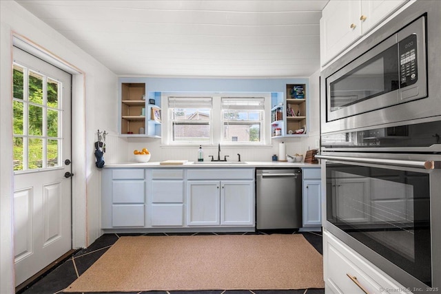 10 Gifford Ln, Norwich, CT 06389 - kitchen with stainless steel appliances, open shelves, plenty of natural light, and dark tile patterned floors