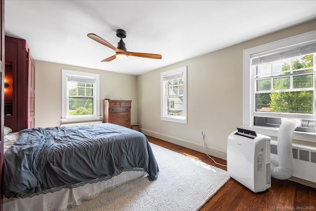 10 Gifford Ln, Norwich, CT 06389 - bedroom with multiple windows, wood finished floors, and ceiling fan