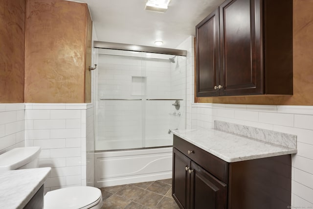 224 Fan Hill Rd, Monroe, CT 06468 - full bath featuring tile walls, vanity, combined bath / shower with glass door, and wainscoting