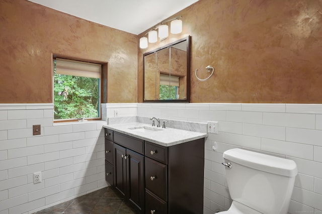 224 Fan Hill Rd, Monroe, CT 06468 - half bath featuring tile walls, a wainscoted wall, vanity, and tile patterned flooring