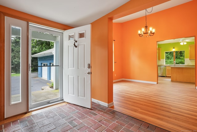 224 Fan Hill Rd, Monroe, CT 06468 - entryway featuring plenty of natural light, a chandelier, and brick floors