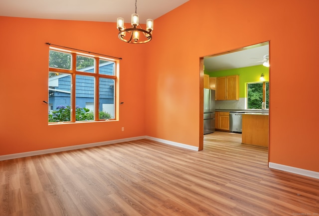 224 Fan Hill Rd, Monroe, CT 06468 - unfurnished dining area featuring light wood-style floors, a chandelier, ceiling fan, and vaulted ceiling