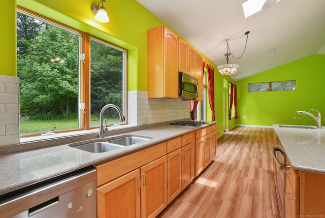 224 Fan Hill Rd, Monroe, CT 06468 - kitchen featuring stainless steel appliances, light wood-style floors, tasteful backsplash, vaulted ceiling, and decorative light fixtures