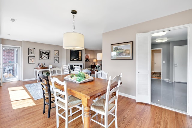 6 Hills Ln Unit 6, Norwalk, CT 06880 - dining space with light wood-style floors and baseboards