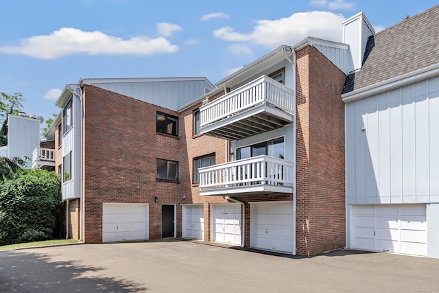 6 Hills Ln Unit 6, Norwalk, CT 06880 - view of apartment building / complex with an attached garage