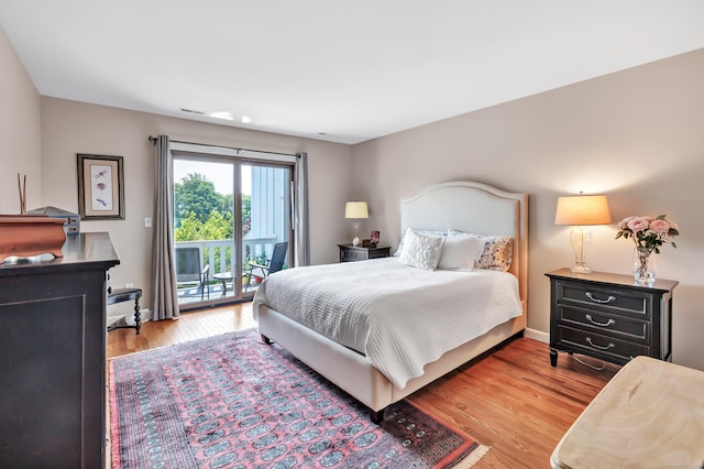 6 Hills Ln Unit 6, Norwalk, CT 06880 - bedroom featuring access to exterior and wood finished floors