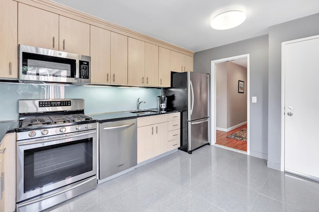 6 Hills Ln Unit 6, Norwalk, CT 06880 - kitchen with stainless steel appliances, light brown cabinets, and dark countertops