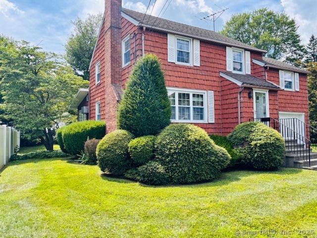 84 Blamey Cir, Stratford, CT 06614 - view of front facade featuring a chimney