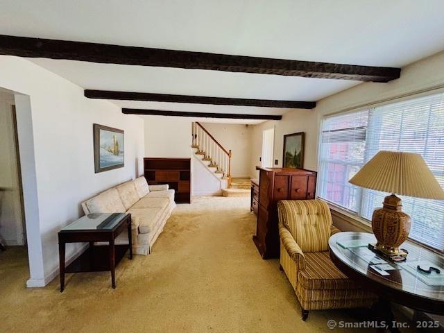84 Blamey Cir, Stratford, CT 06614 - living room with light carpet, stairs, and beam ceiling