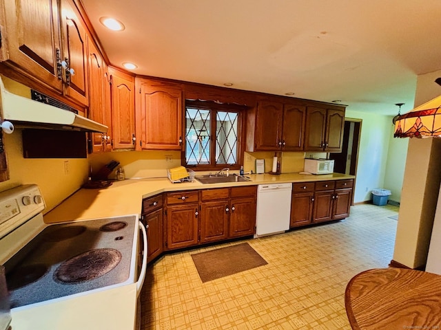 84 Blamey Cir, Stratford, CT 06614 - kitchen featuring white appliances, light countertops, recessed lighting, brown cabinetry, and light floors