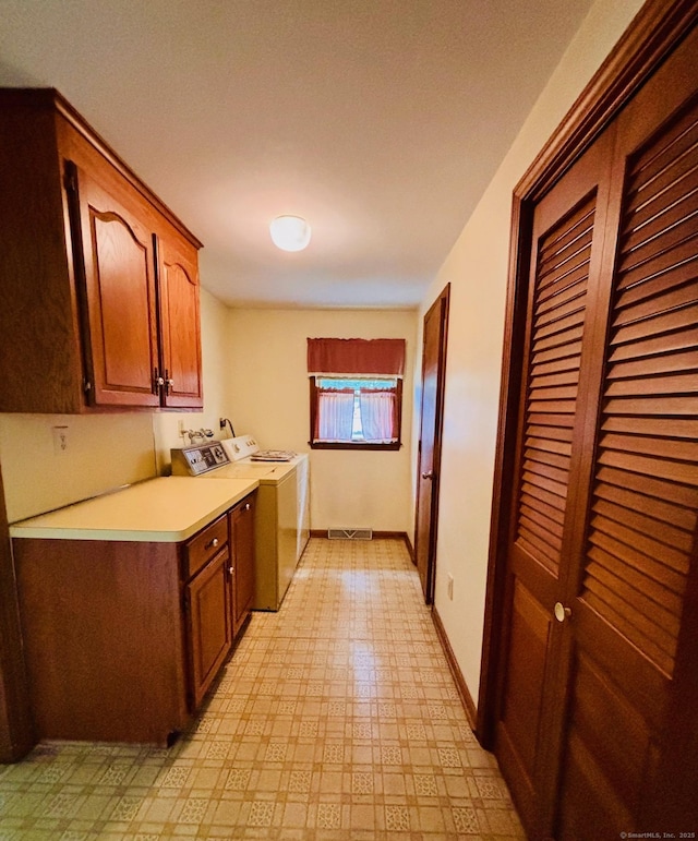 84 Blamey Cir, Stratford, CT 06614 - kitchen featuring independent washer and dryer, light countertops, light floors, and brown cabinets