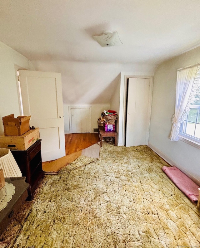 84 Blamey Cir, Stratford, CT 06614 - additional living space featuring lofted ceiling and wood finished floors