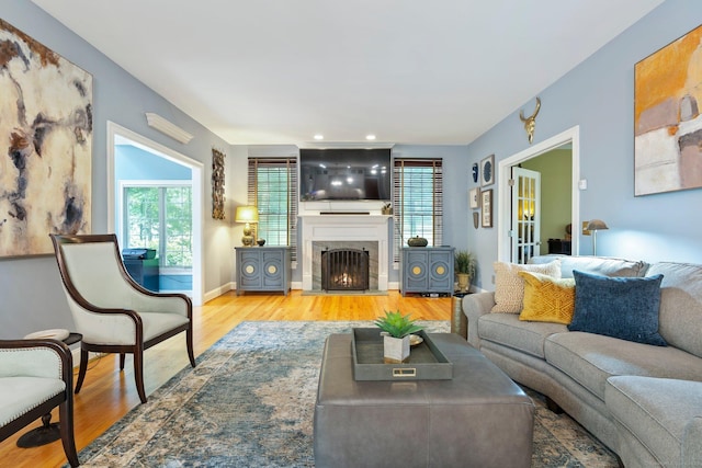 80 Jeremiahs Way, Glastonbury, CT 06073 - living room with wood finished floors, a fireplace with flush hearth, and recessed lighting