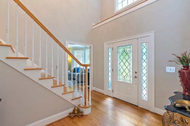 80 Jeremiahs Way, Glastonbury, CT 06073 - entryway featuring wood finished floors, stairway, and a towering ceiling