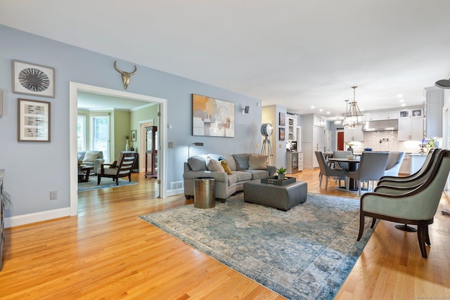 80 Jeremiahs Way, Glastonbury, CT 06073 - living area with light wood-style floors, a chandelier, and recessed lighting