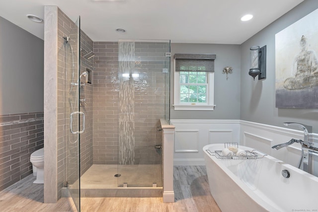 80 Jeremiahs Way, Glastonbury, CT 06073 - full bathroom featuring wood finished floors, a wainscoted wall, a shower stall, a soaking tub, and recessed lighting