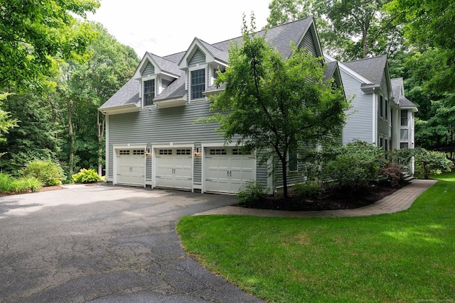 80 Jeremiahs Way, Glastonbury, CT 06073 - view of property exterior with asphalt driveway, a garage, and a shingled roof