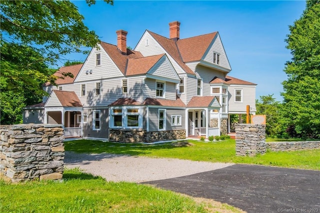 75 Green Hill Rd, Washington, CT 06793 - rear view of property with a chimney, a lawn, stone siding, and a shingled roof