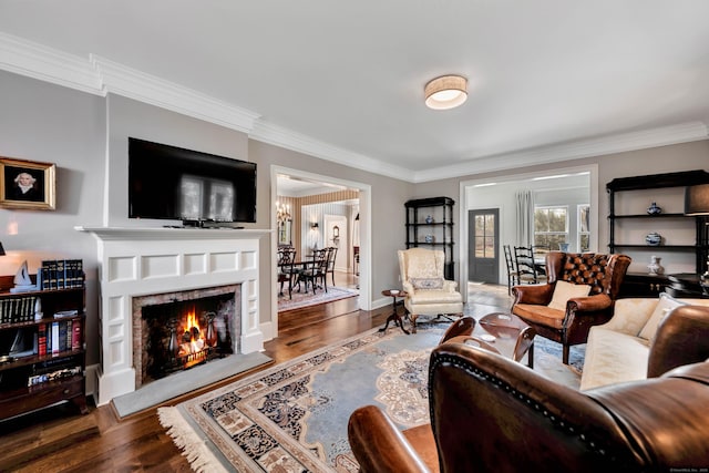 75 Green Hill Rd, Washington, CT 06793 - living area with ornamental molding, wood finished floors, and a lit fireplace