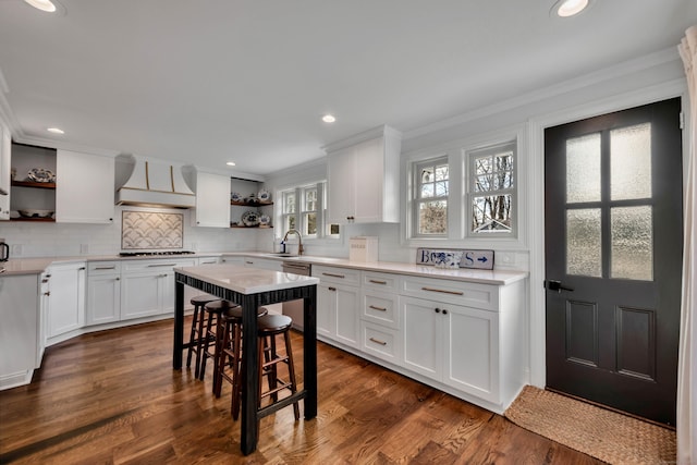 75 Green Hill Rd, Washington, CT 06793 - kitchen featuring open shelves, custom exhaust hood, cooktop, crown molding, and tasteful backsplash