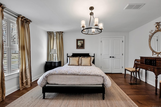 75 Green Hill Rd, Washington, CT 06793 - bedroom with multiple windows, a chandelier, dark wood finished floors, and a closet