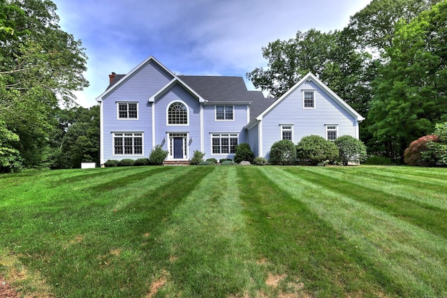 8 Dogwood Ct, Woodbridge, CT 06525 - view of front of property with a chimney and a front yard